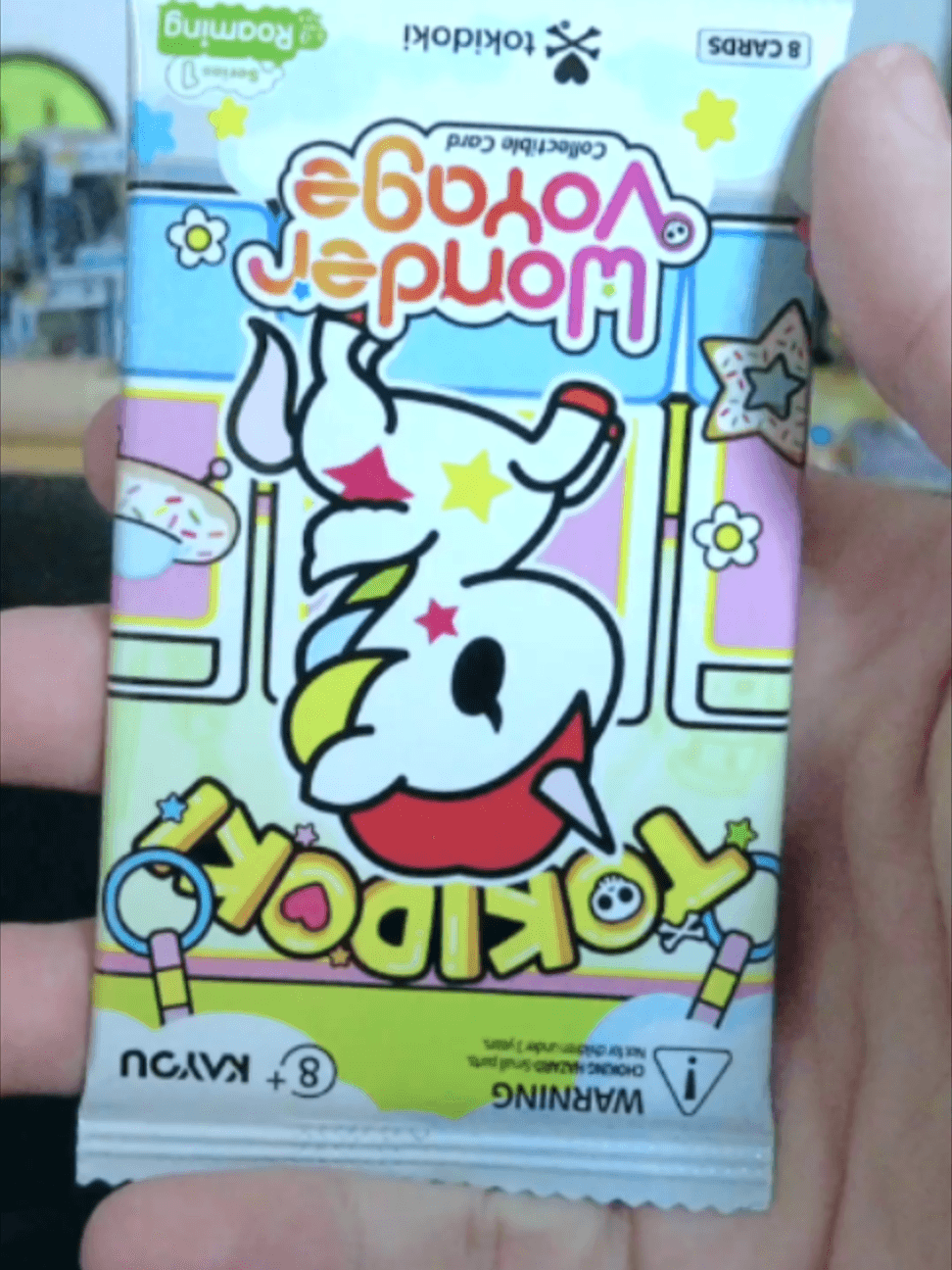 Ripping 5 packs of the stunning new Kayou Tokidoki Wonder Voyage at the Vault! π¦β¨ The transparent card designs and neon prism foils are nex